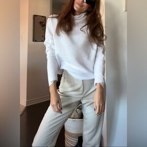White turtleneck top with batwing